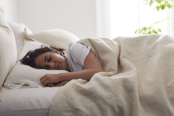 Woman Laying Under Ivory Duvet Cover Woman Laying Under Ivory Duvet Cover